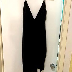 New without tags. Sexy blk faux suede dress w/ slit in front and zip back. Lg